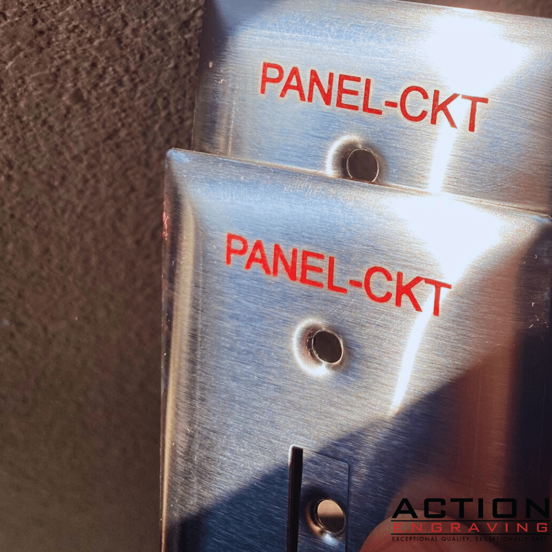 Red characters engraved on stainless steel device covers Red characters engraved on stainless steel device covers