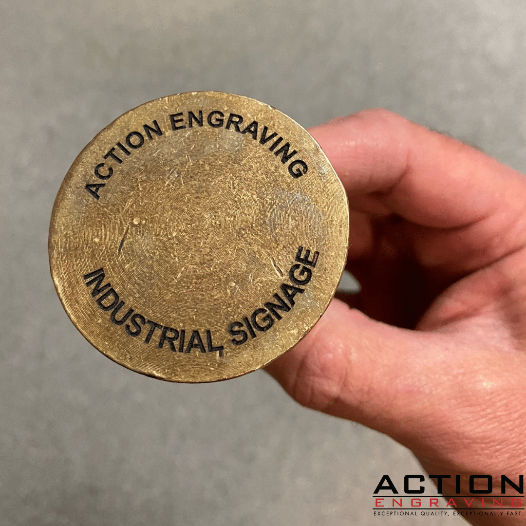 Engraved brass plug for concrete